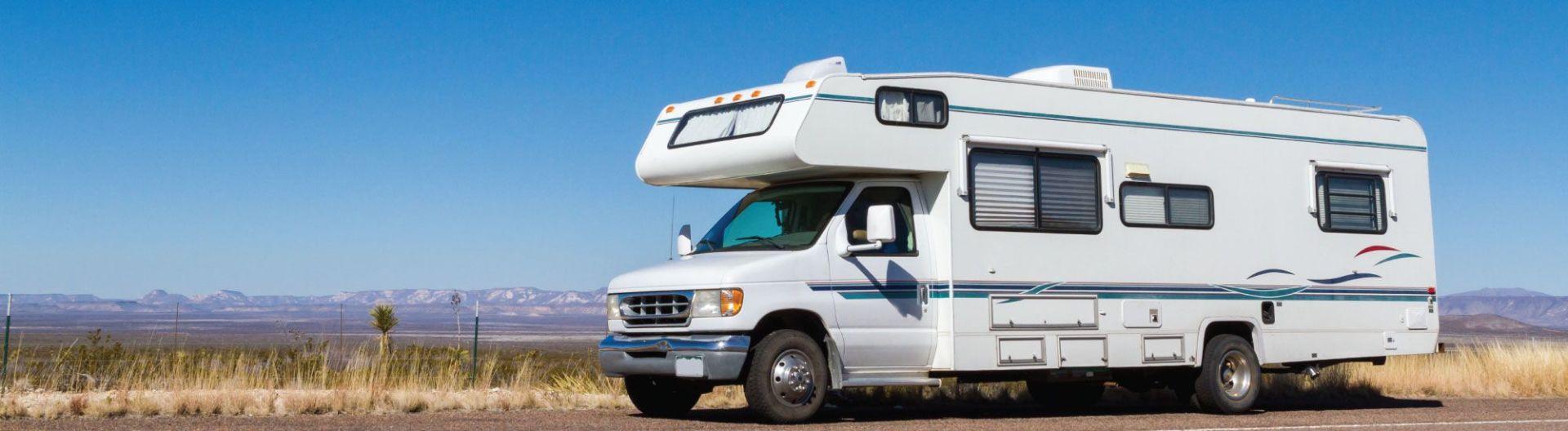 RV parked roadside on the open plains